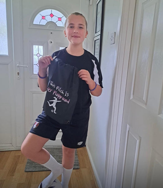 Young Champion of the Month September winner wearing custom girls football training wear.